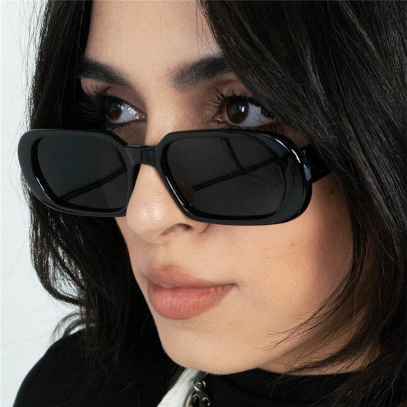 Small square sunglasses with UV400 protection for men and women in retro fashion style